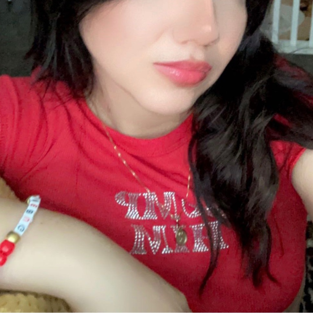 Red super cropped “DUMP HIM” rhinestone top.